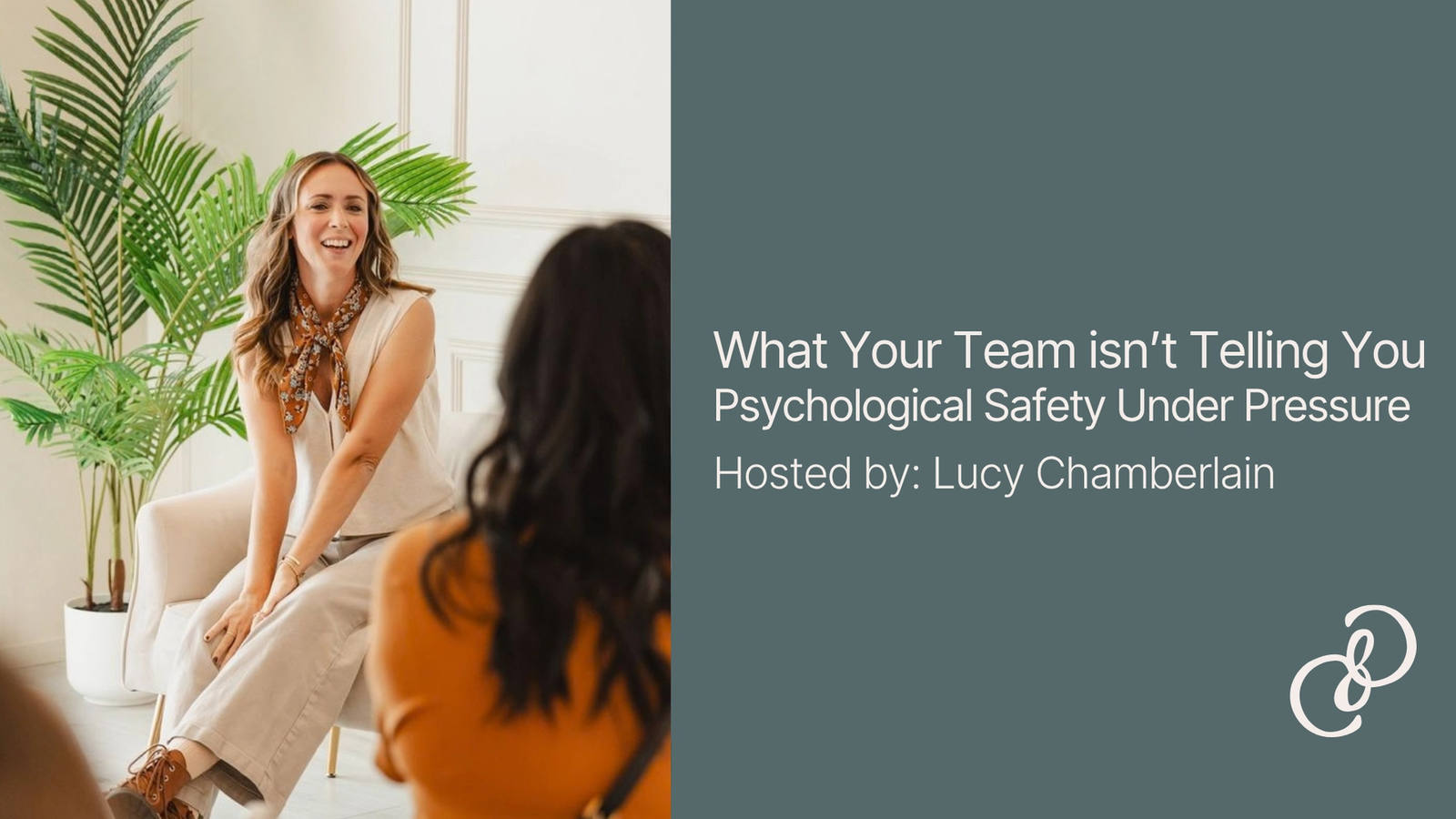 A woman sat on a chair speaking to a blurred group with the title of the event shown: What your team isn't telling you, Psychological Safety under Pressure