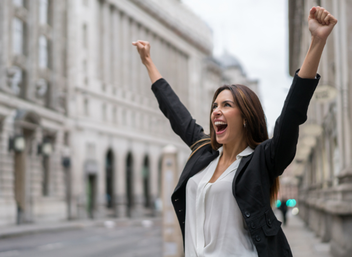 business woman celebrating in London street