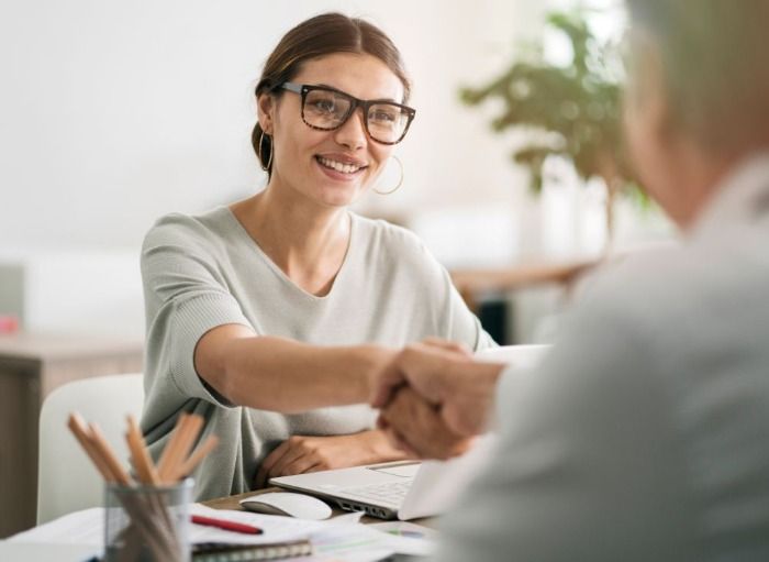 Job candidate shaking hand of employer