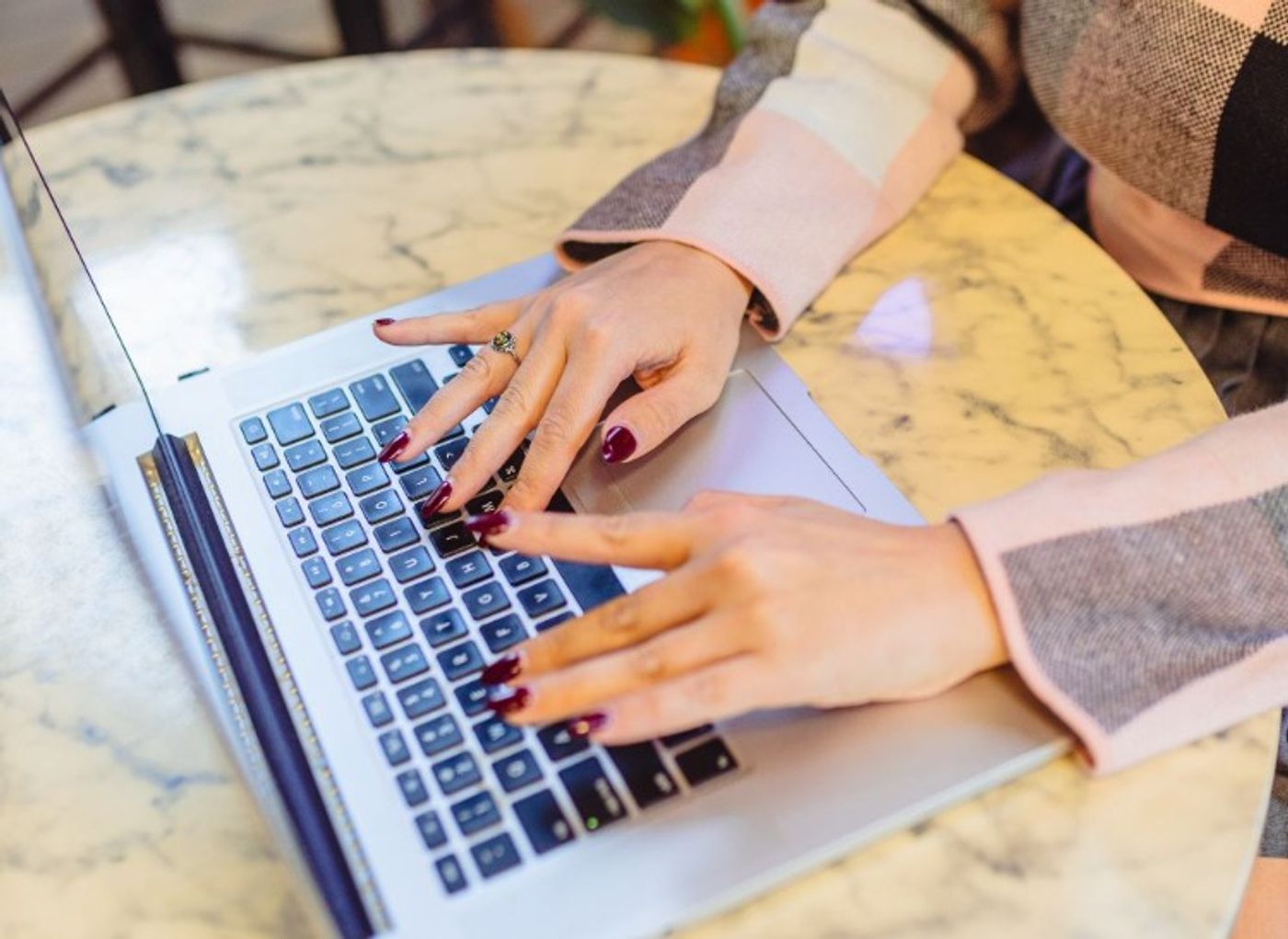 woman typing on a laptop