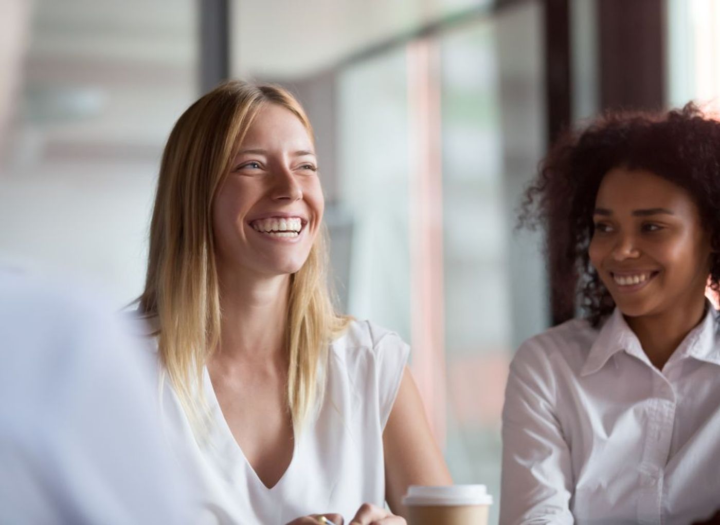 Two business women smiling