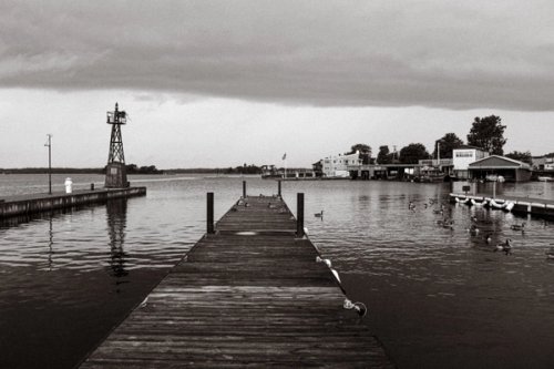 Image of dock and river in black and white