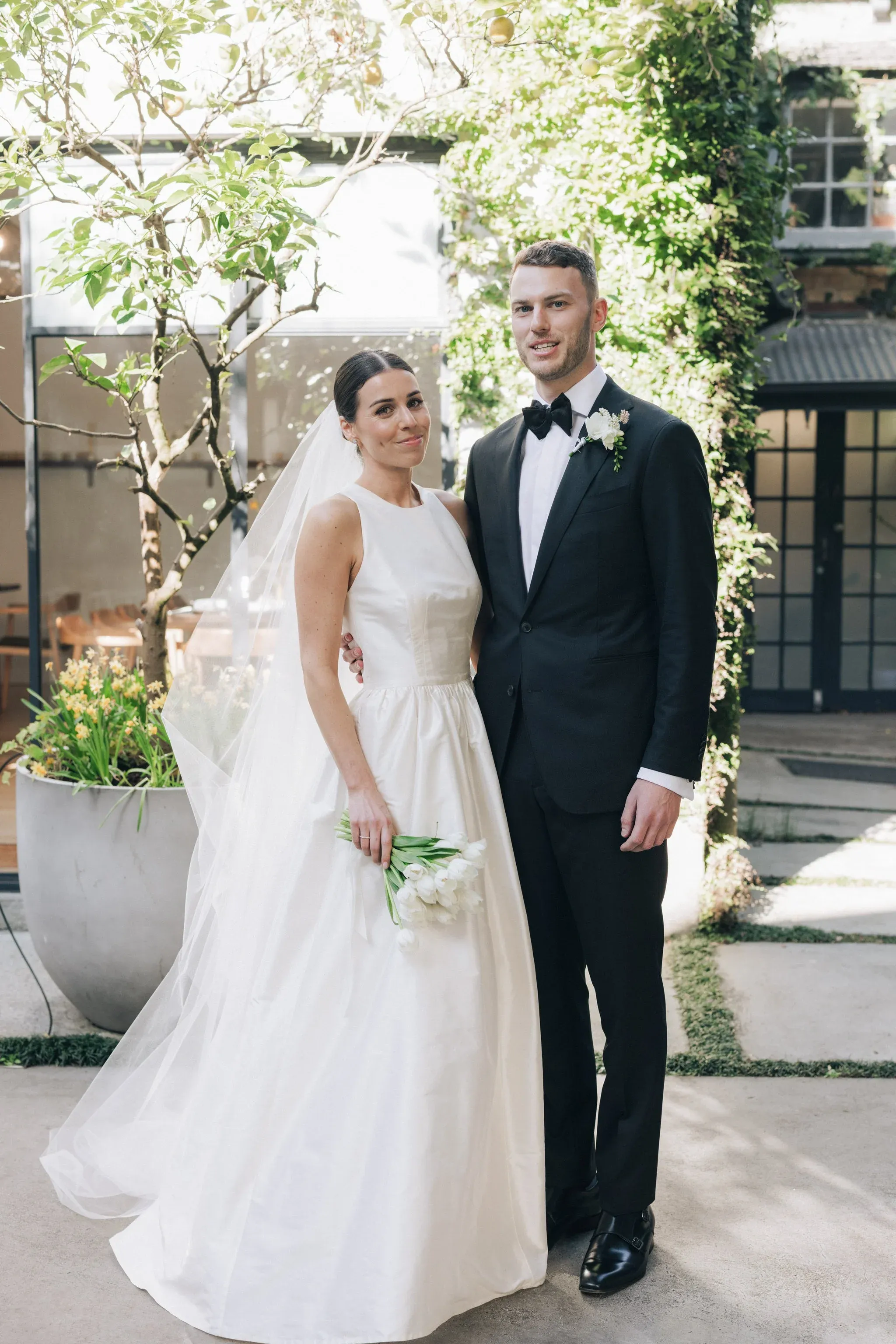 Andrew and Sophie standing in courtyard