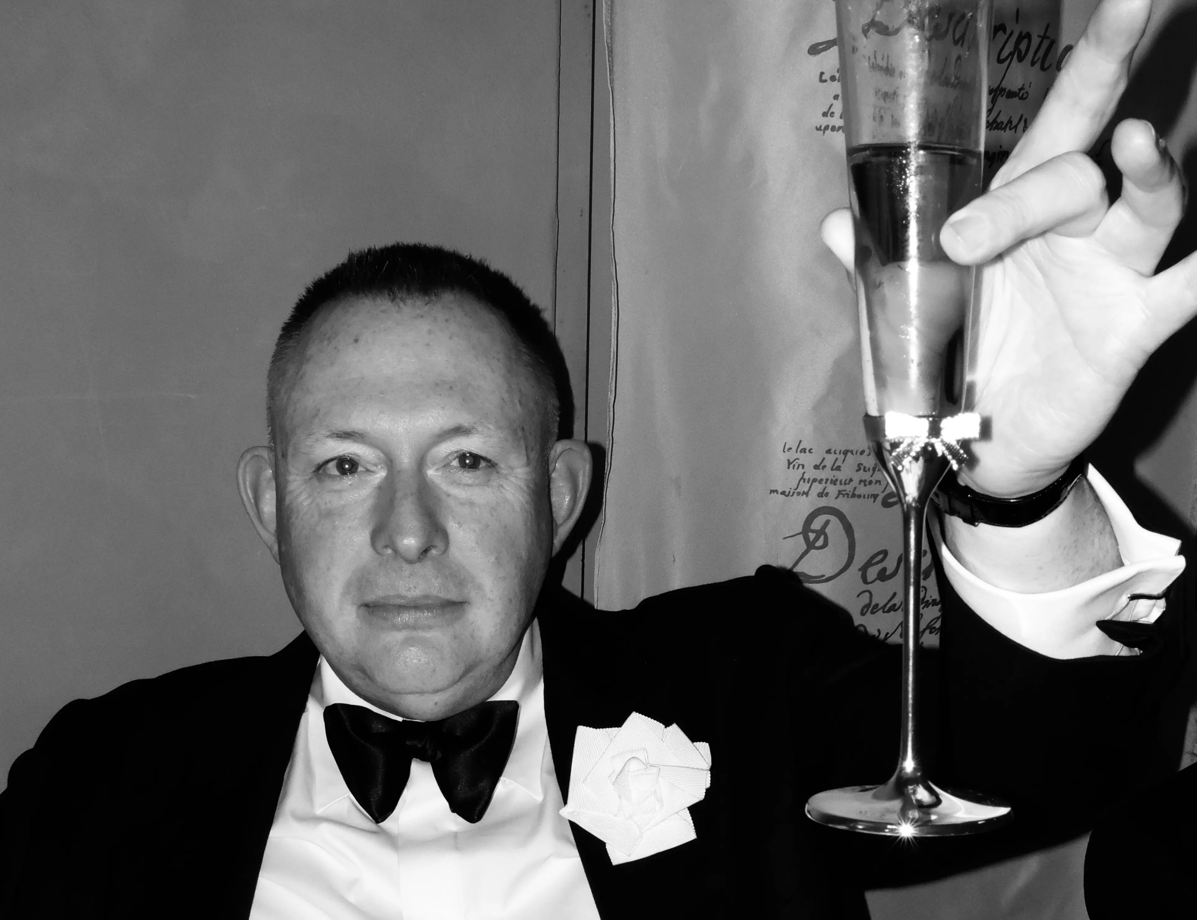 Murray Crane toasting a glass of champagne