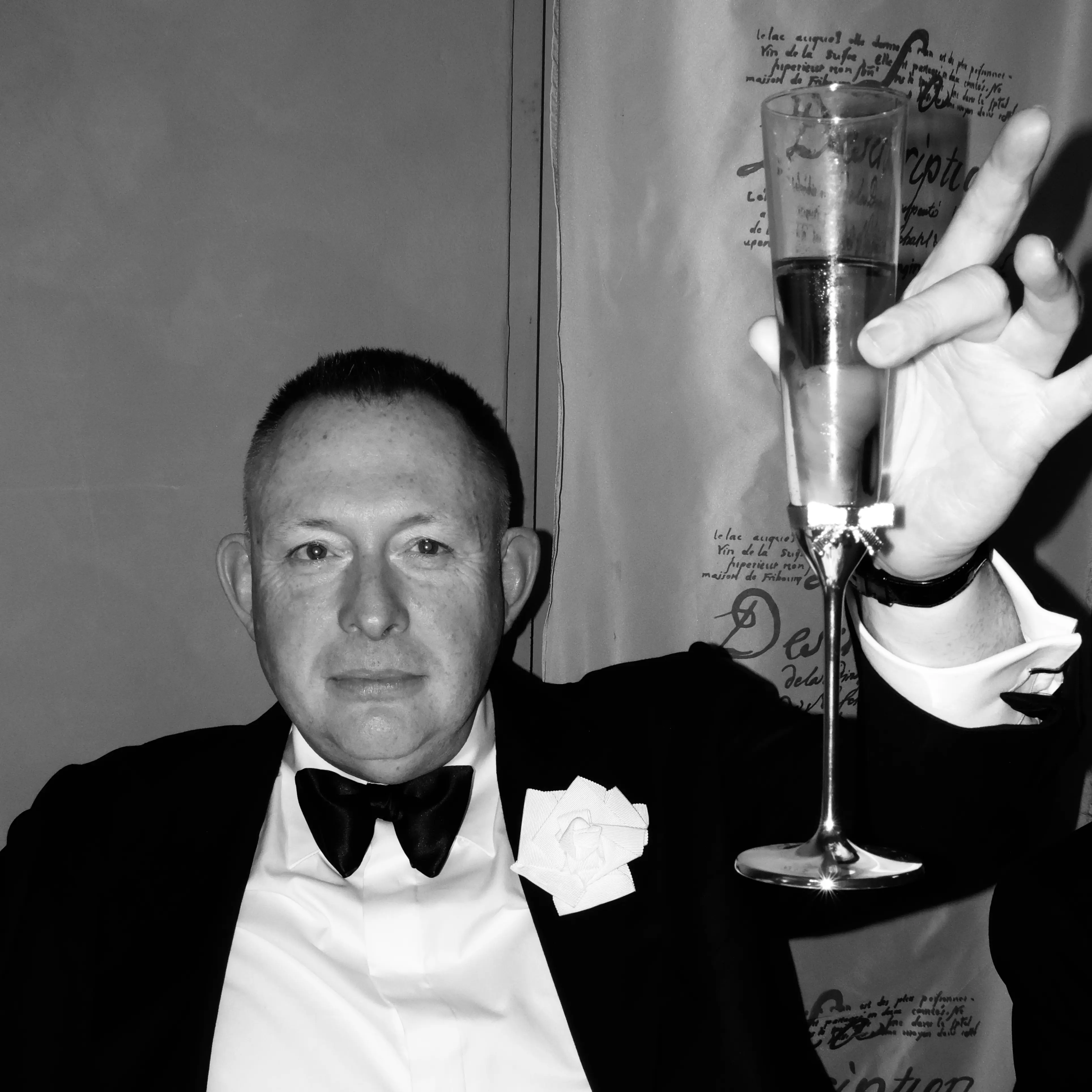 Murray Crane toasting a glass of champagne