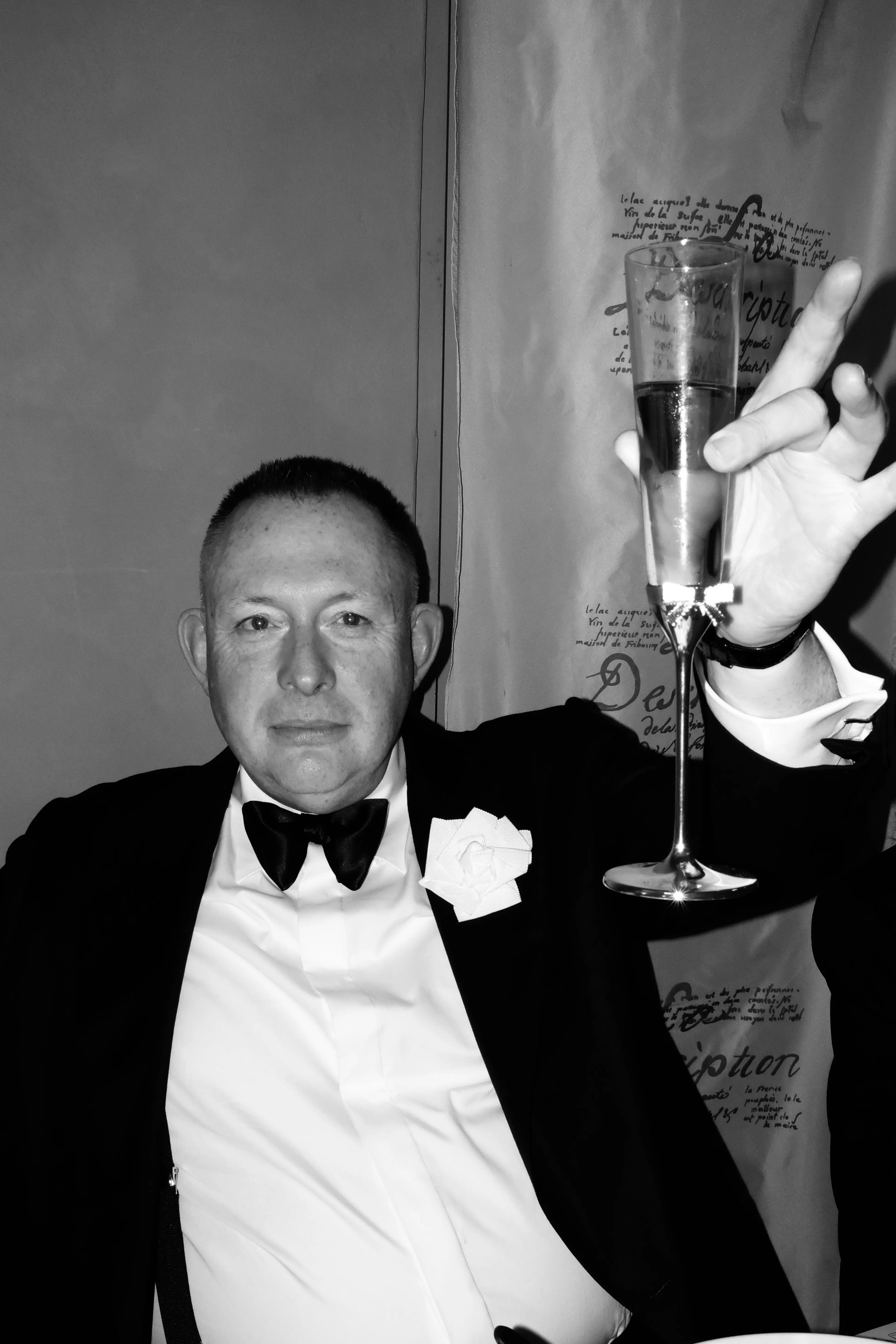 Murray Crane toasting a glass of champagne