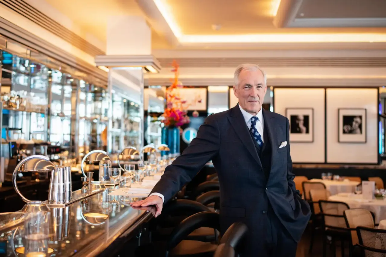 Jeremy King leaning on bar in Arlington