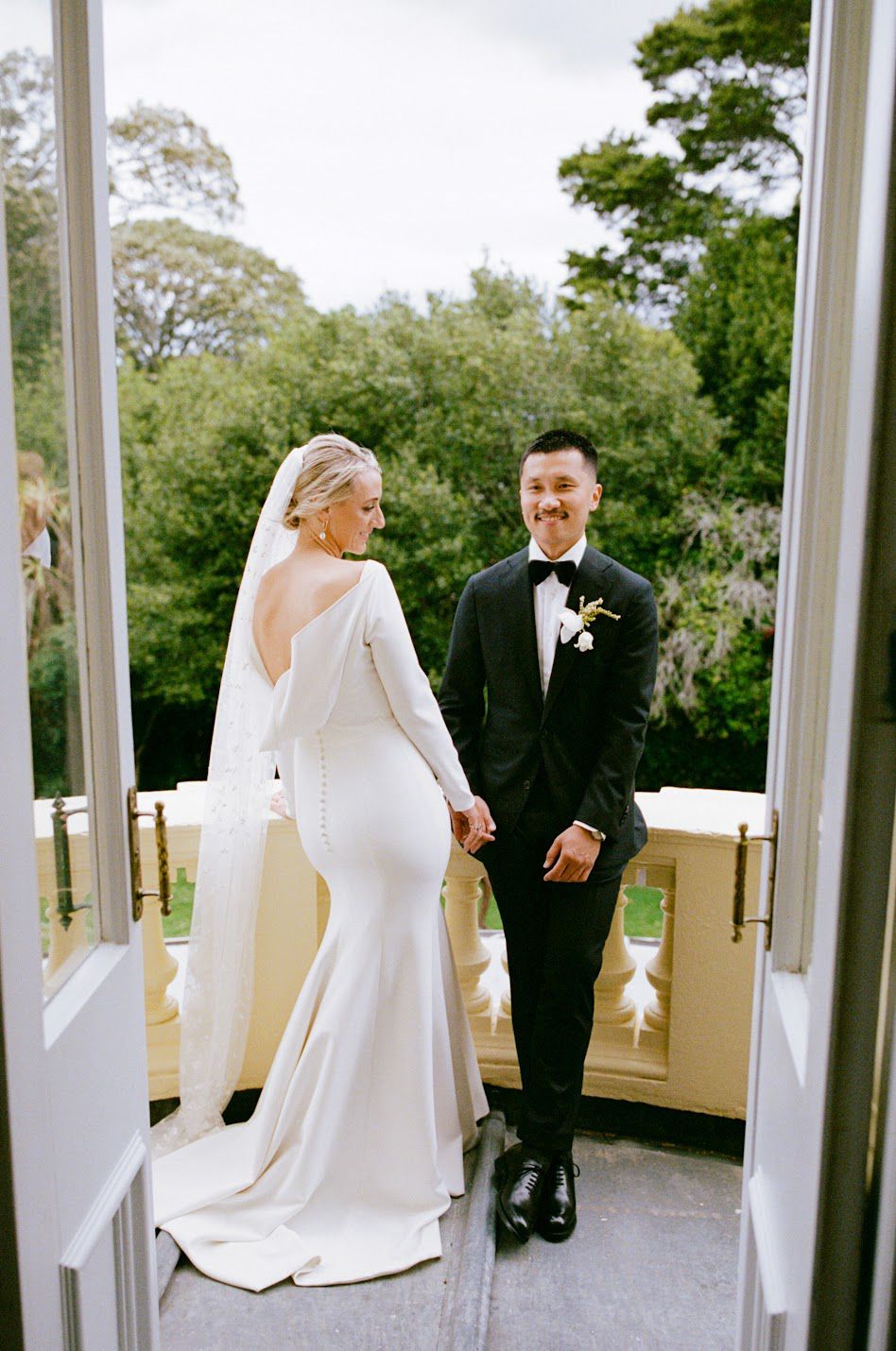 Albert and Poppy standing on balcony
