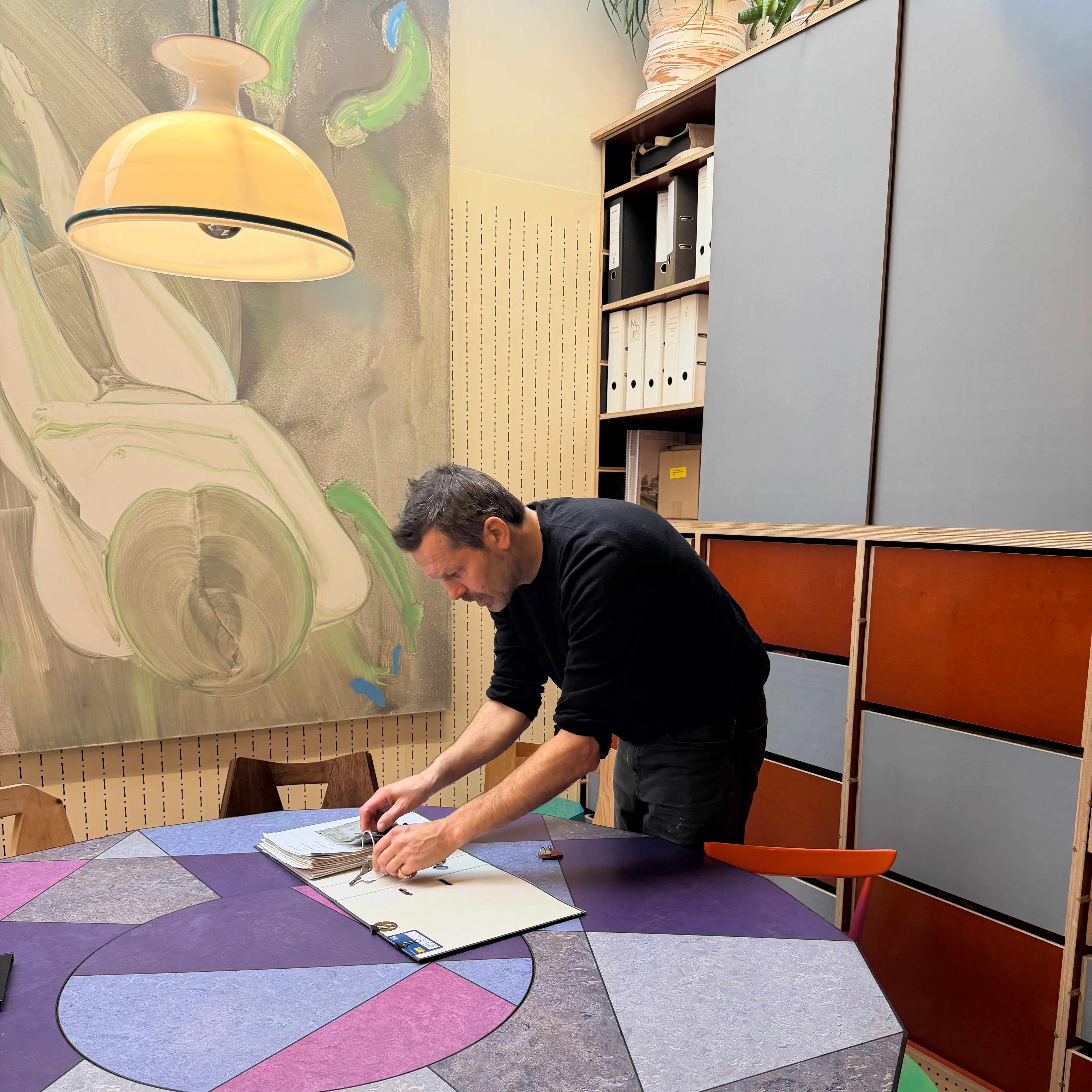 Martin Gamper leaning over book