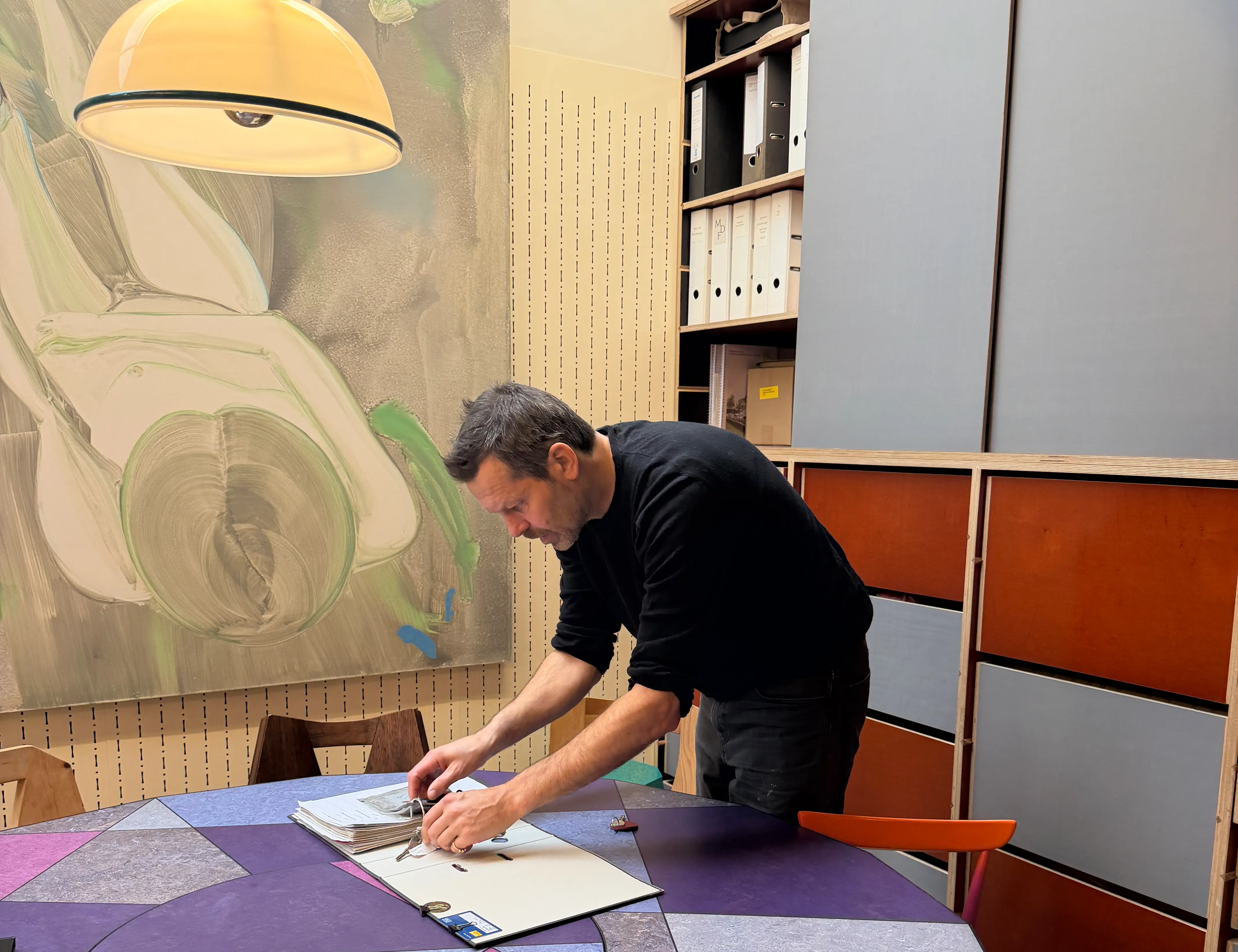 Martin Gamper leaning over book