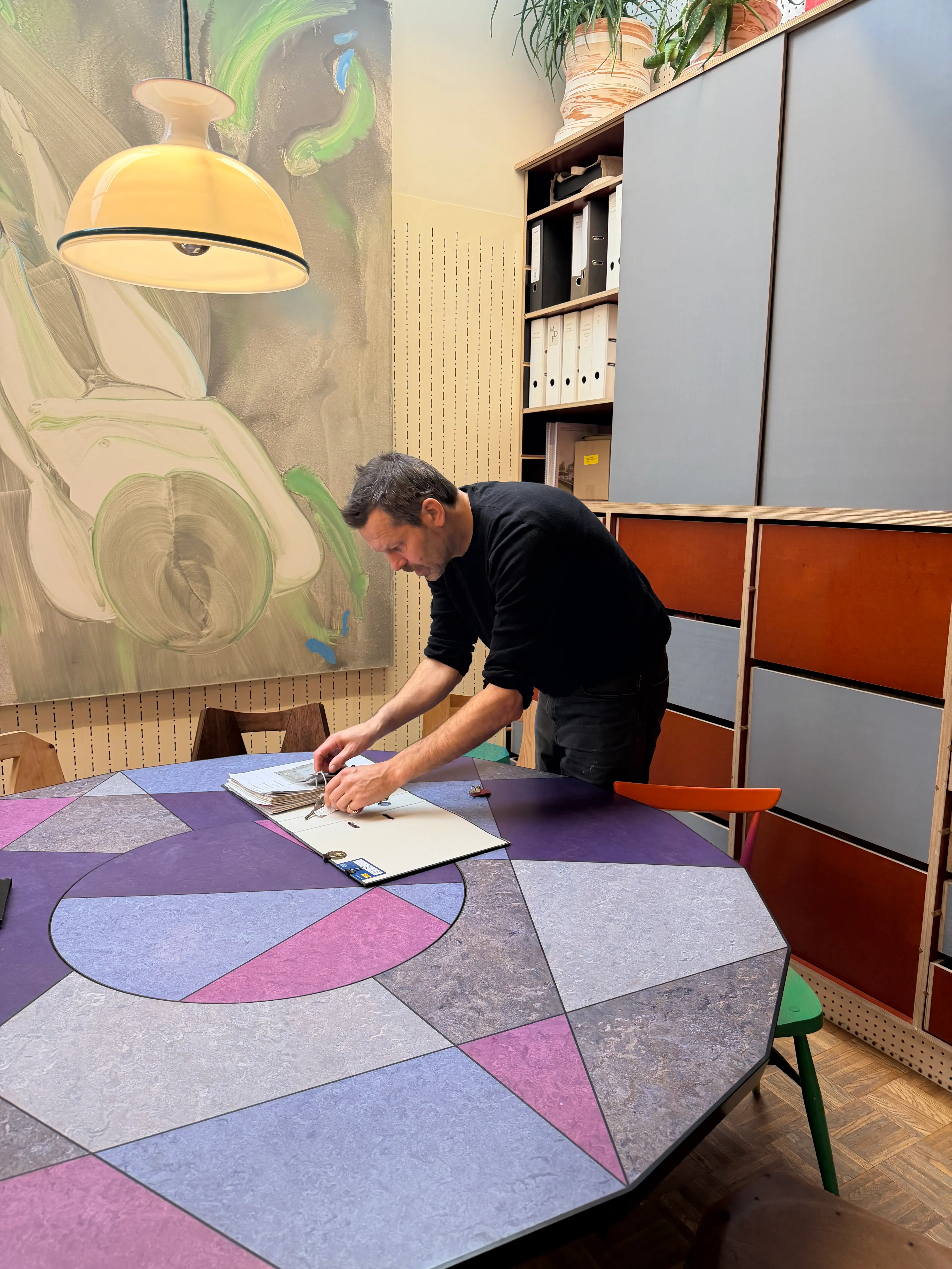 Martin Gamper leaning over book