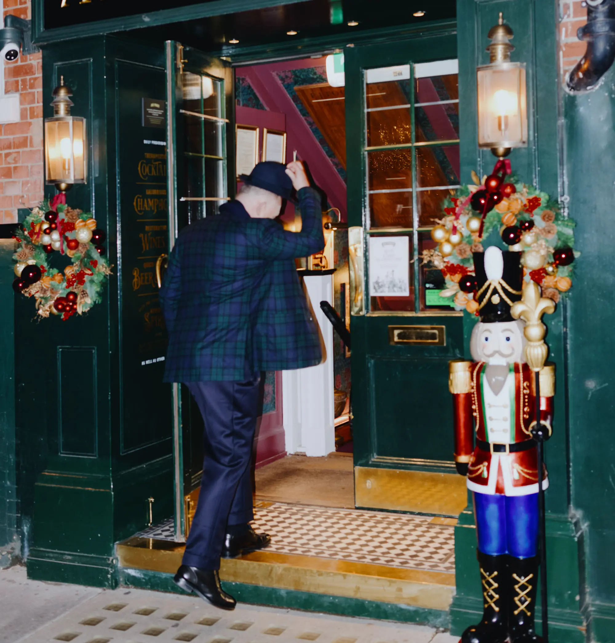 Man walking through entrance of P.J.Fogg & Co Apothecary