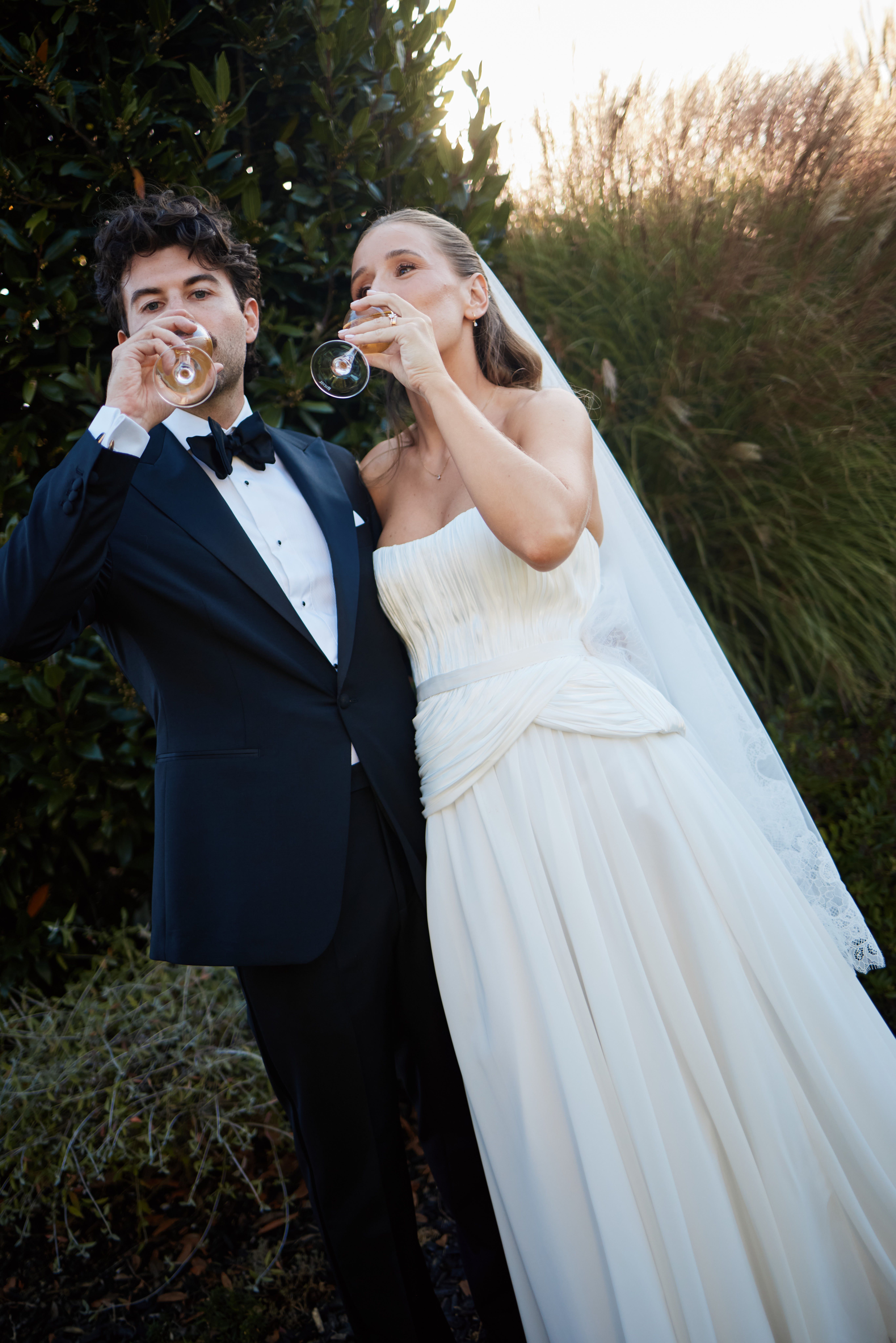 Bride and Groom drinking champagne