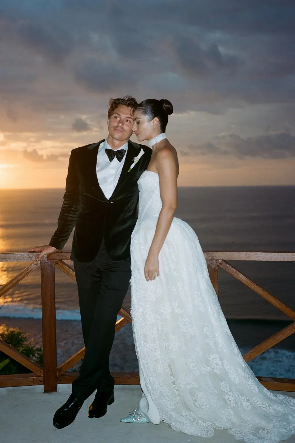 Logan and Sequoia standing on a balcony