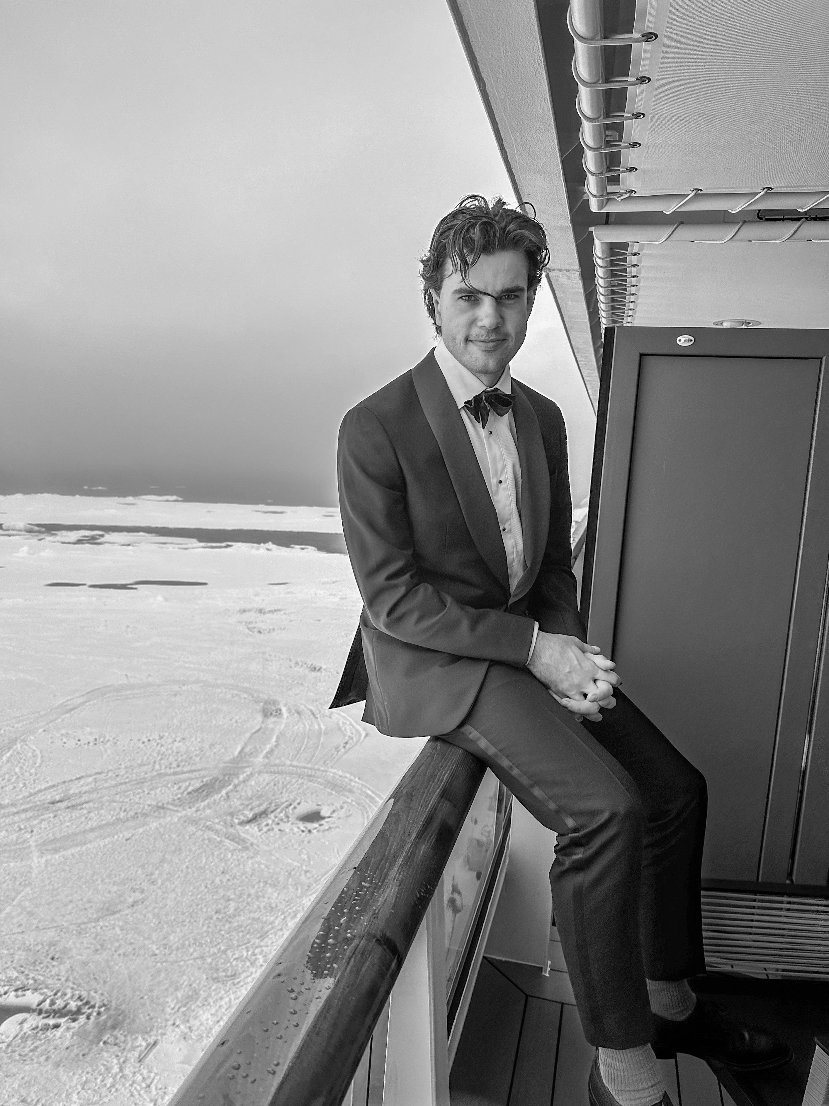 Alex Hillary in a Tuxedo with the Arctic in the background