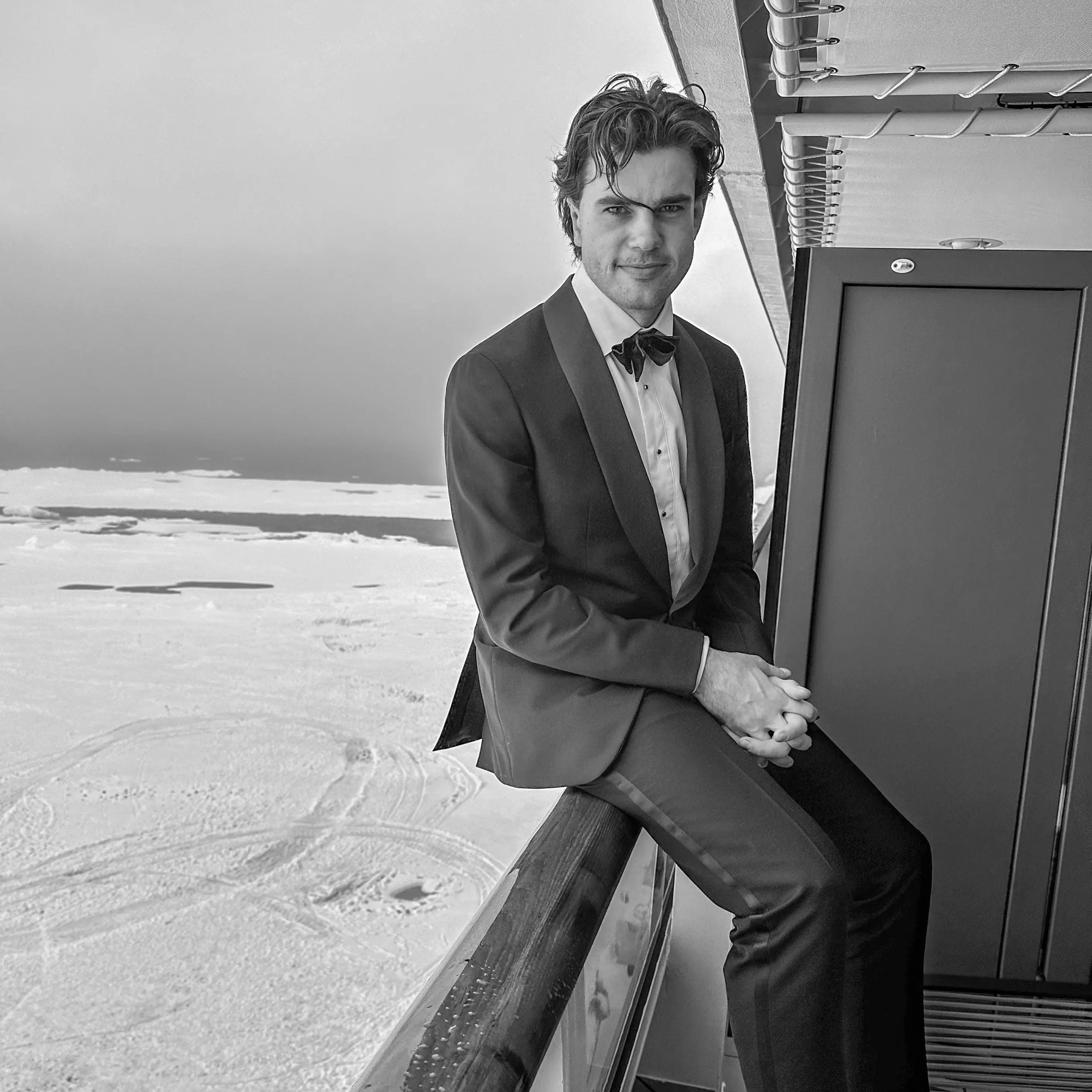 Alex Hillary in a Tuxedo with the Arctic in the background