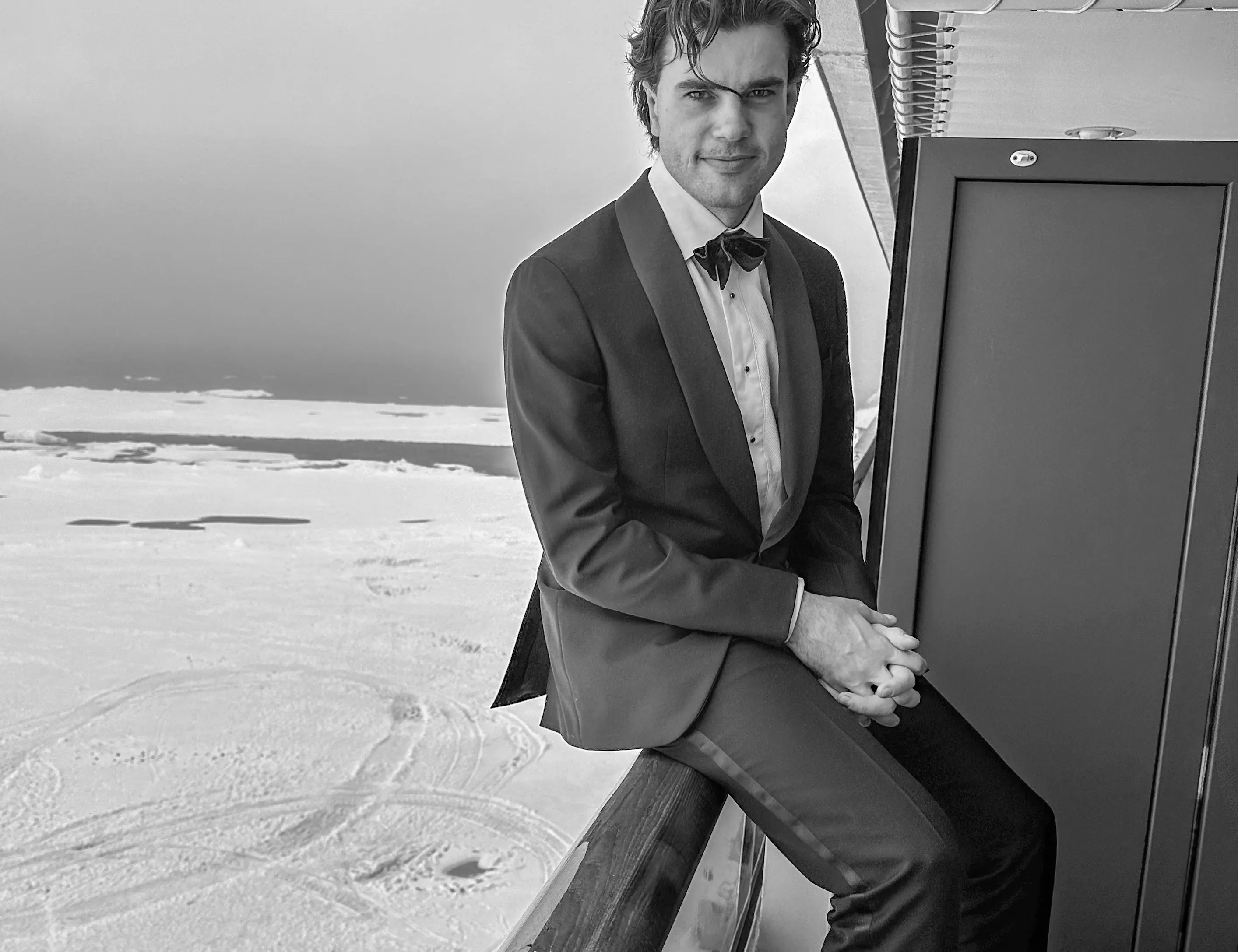 Alex Hillary in a Tuxedo with the Arctic in the background