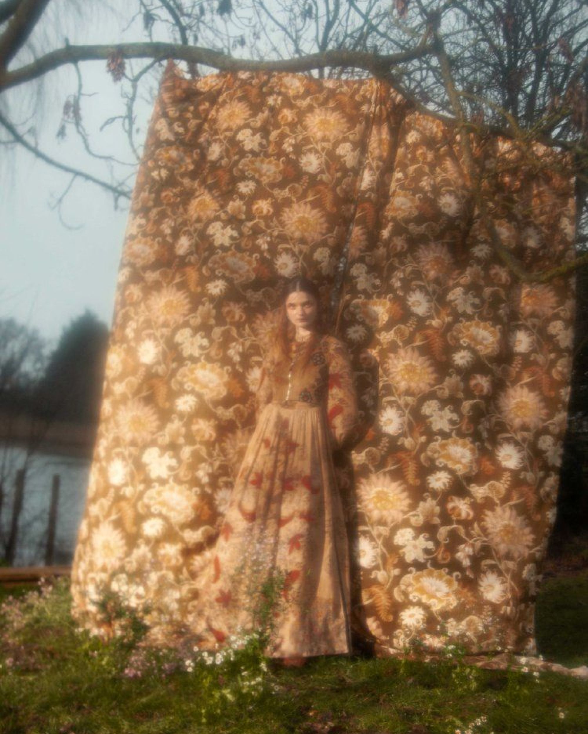 Harper's Bazaar Thumbnail of a woman in front of a flower pattern blanket