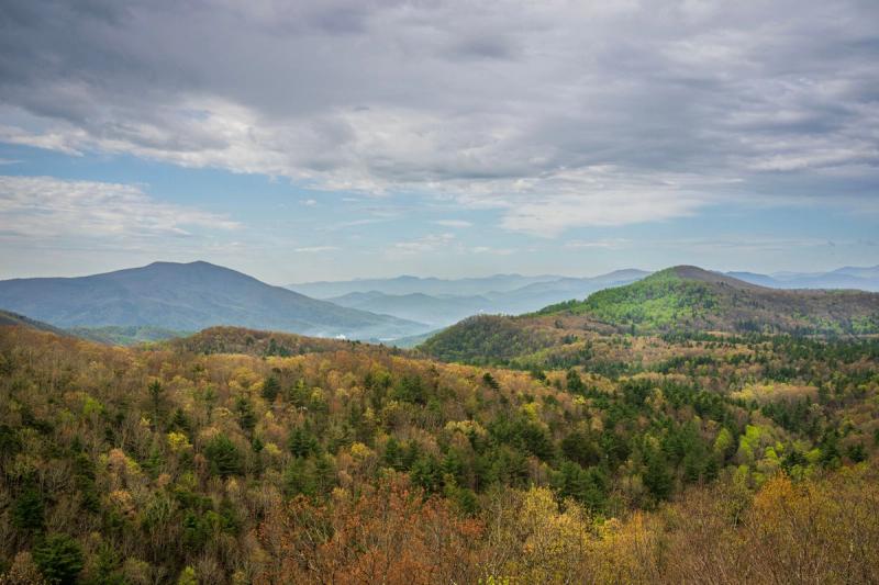 Forested hills and a wide mountain landscape