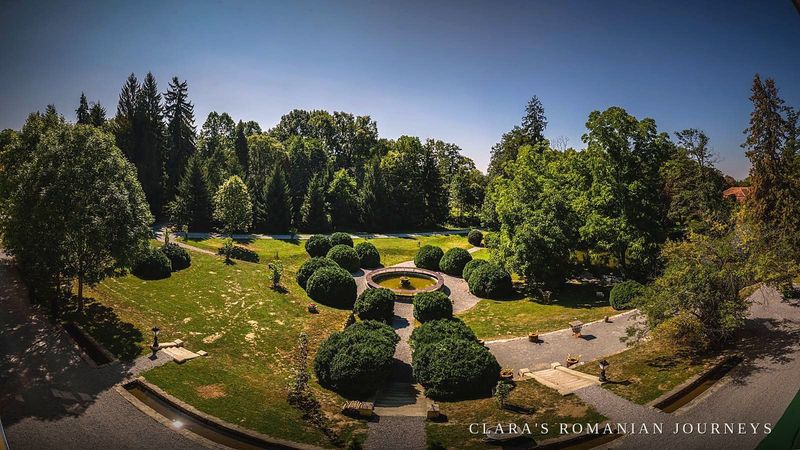 Aerial view of the formal garden with a circular fountain and clipped topiary