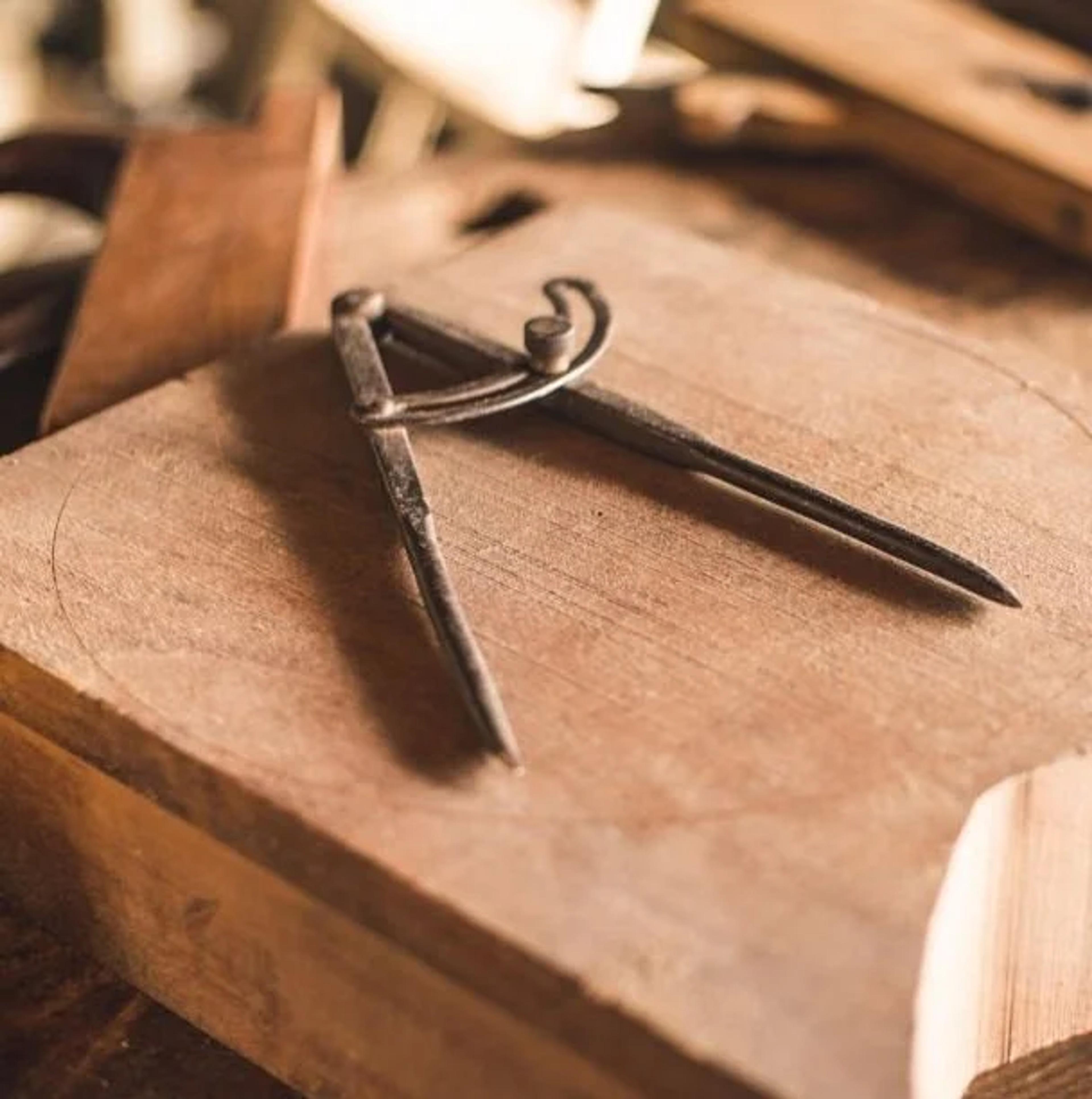 Drafting compass on a drawing