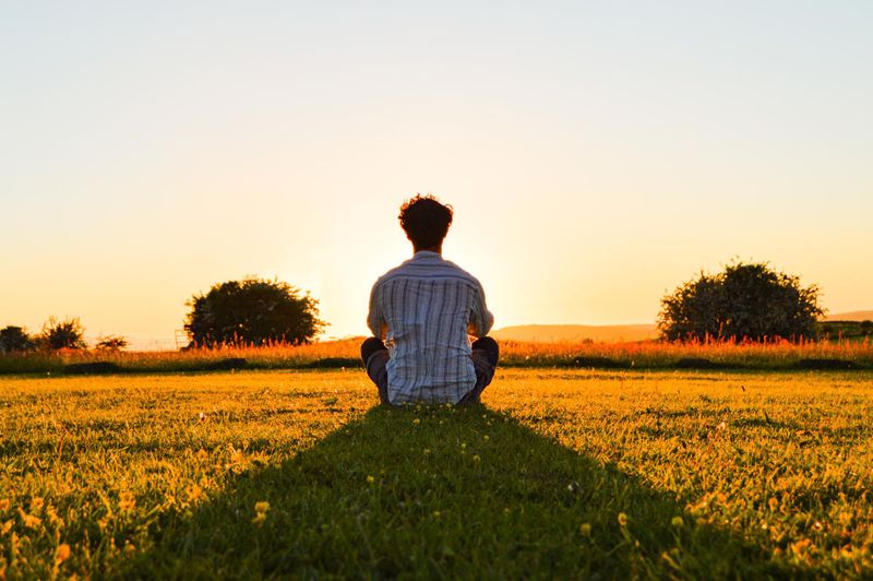 A person praying outdoors