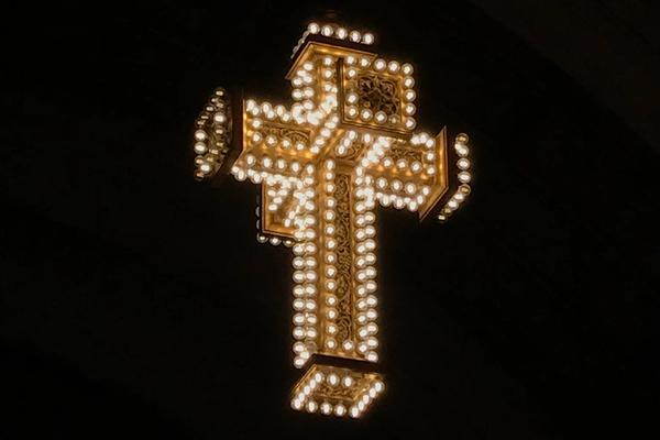 A lit cross decoration in Liu's church at Detroit's Masonic Temple