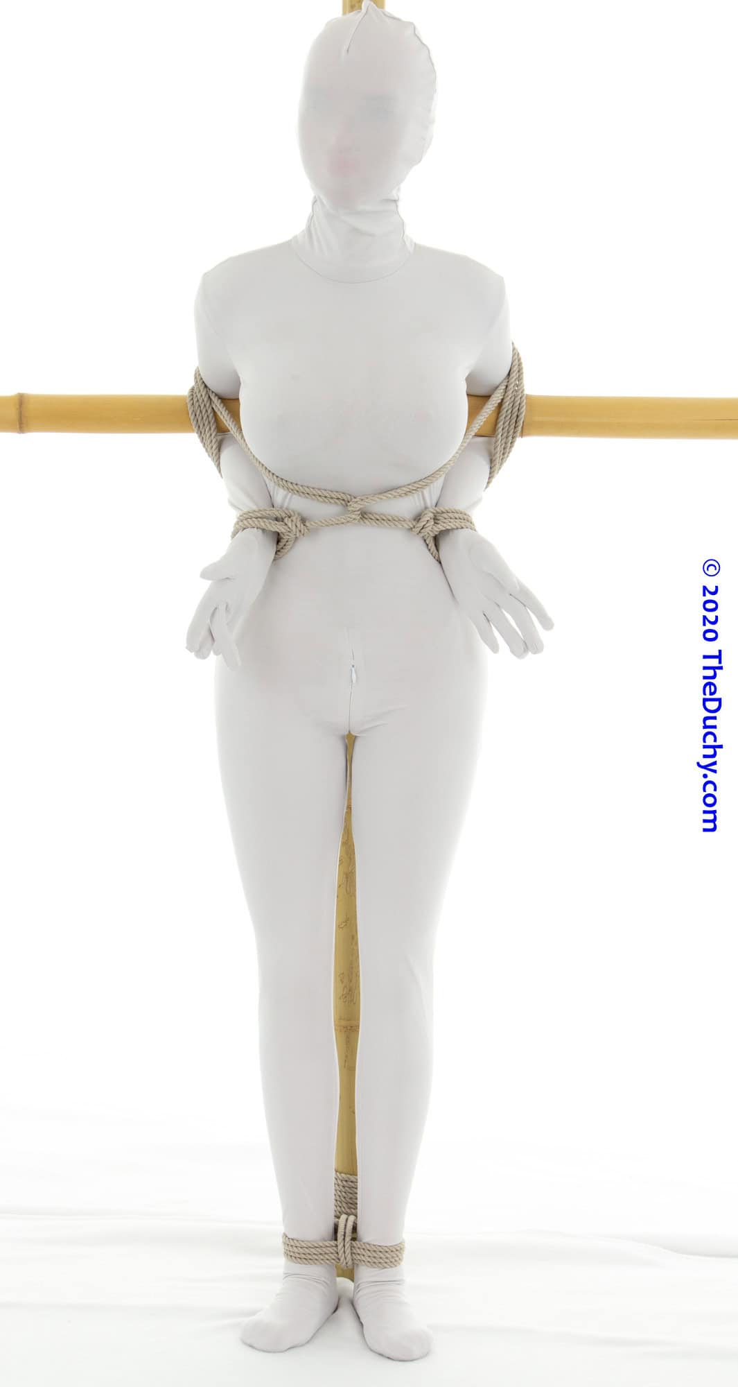 5.	But we can make this significantly more restrictive by tying the ankle to the upright using a Triple Column.  I like the Triple Column [TC ①] approach because it can be made less restrictive, allowing your partner a bit of room to adjust their footing, but not so much that they can wriggle free