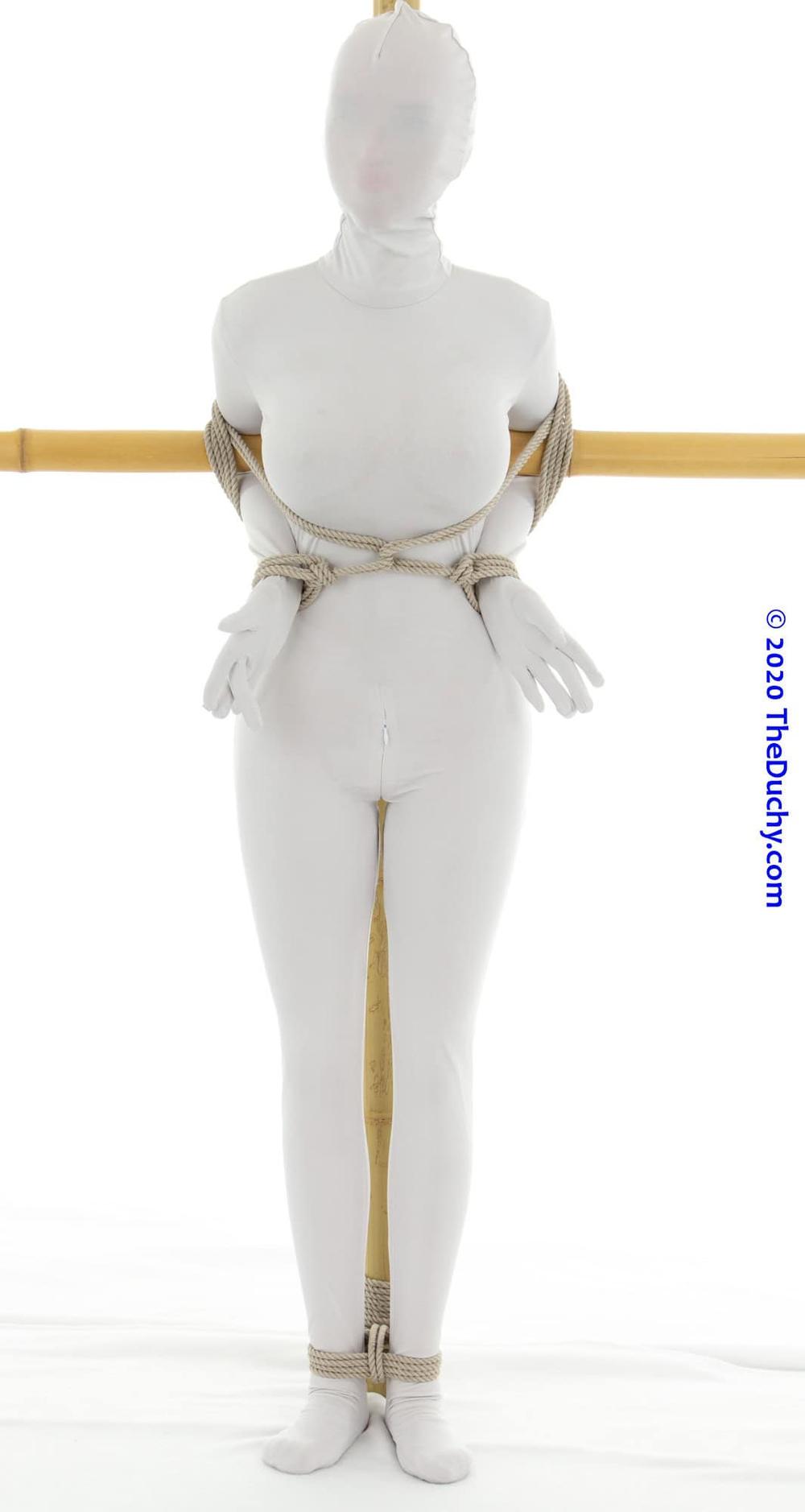 5.	But we can make this significantly more restrictive by tying the ankle to the upright using a Triple Column.  I like the Triple Column [TC ①] approach because it can be made less restrictive, allowing your partner a bit of room to adjust their footing, but not so much that they can wriggle free