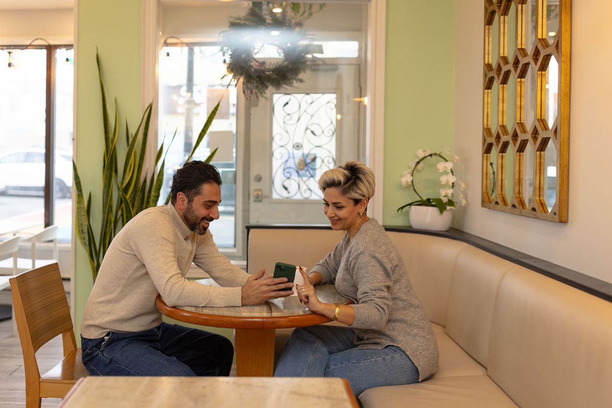 2 person laughing and enjoying at the Bella Aurora Cafe