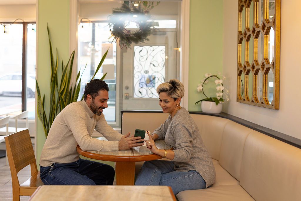 2 person laughing and enjoying at the Bella Aurora Cafe