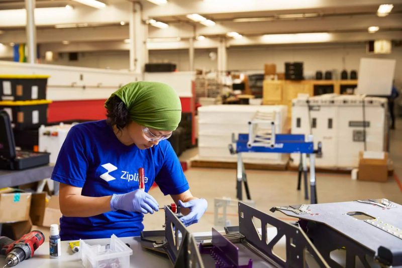 Worker Assembling Product in Workshop