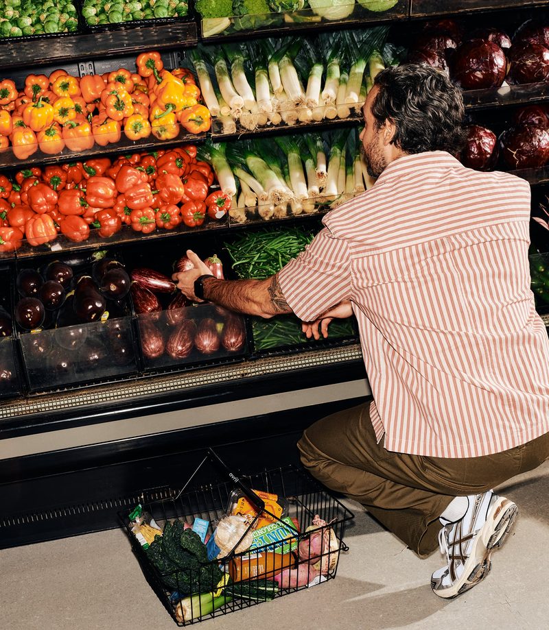 Shopper at the produce wall