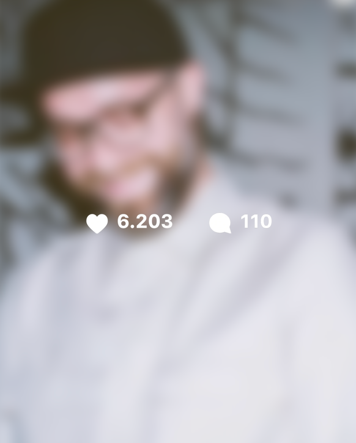 Darkened Instagram post with 6.203 likes and 110 comments: Mark Forster in a backwards cap and pale shirt smiles and looks down.