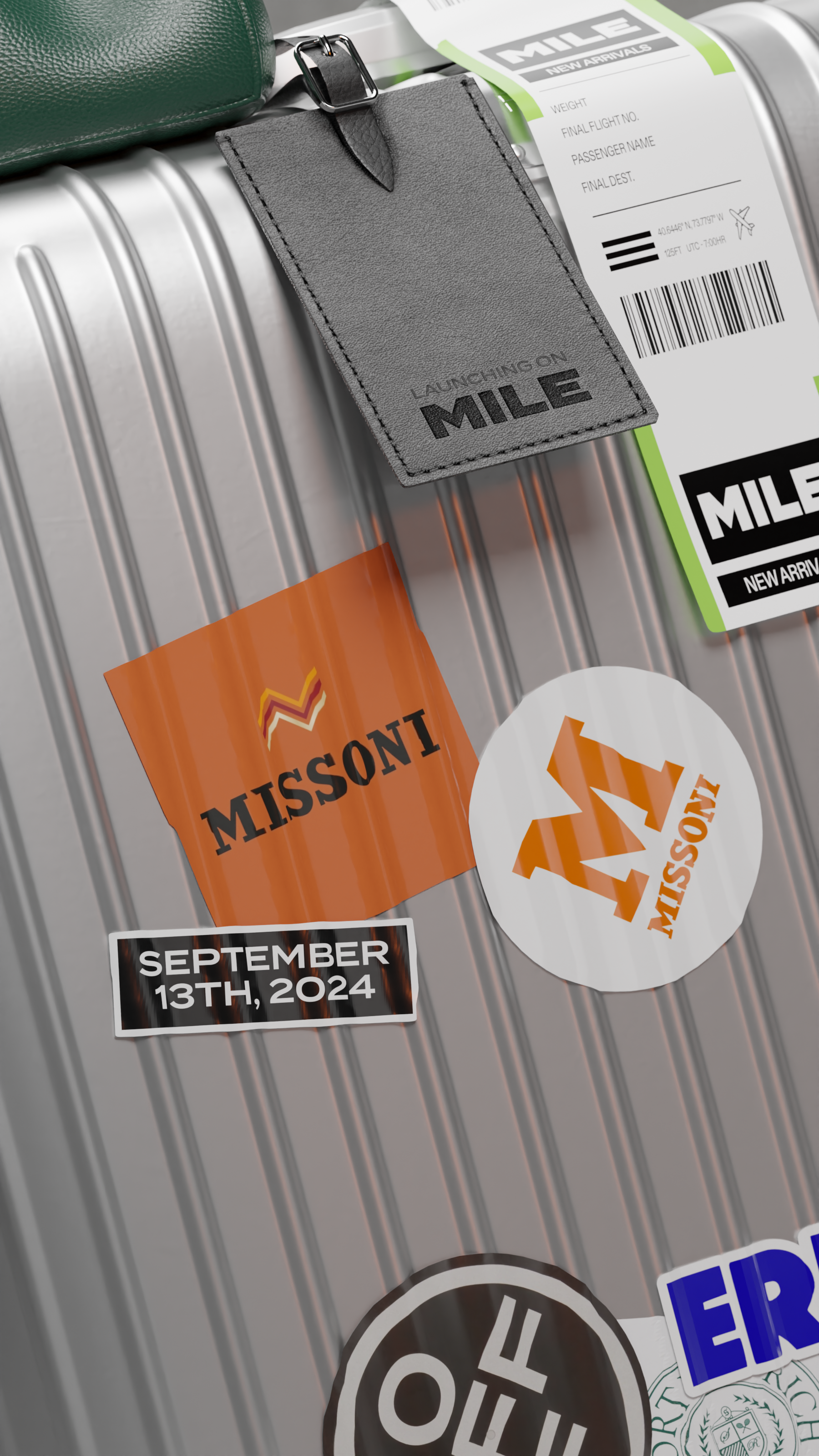 Close-up of the ribbed silver suitcase: two Missoni stickers and a label dated September 13th, 2024, under a grey leather tag embossed "LAUNCHING ON MILE".