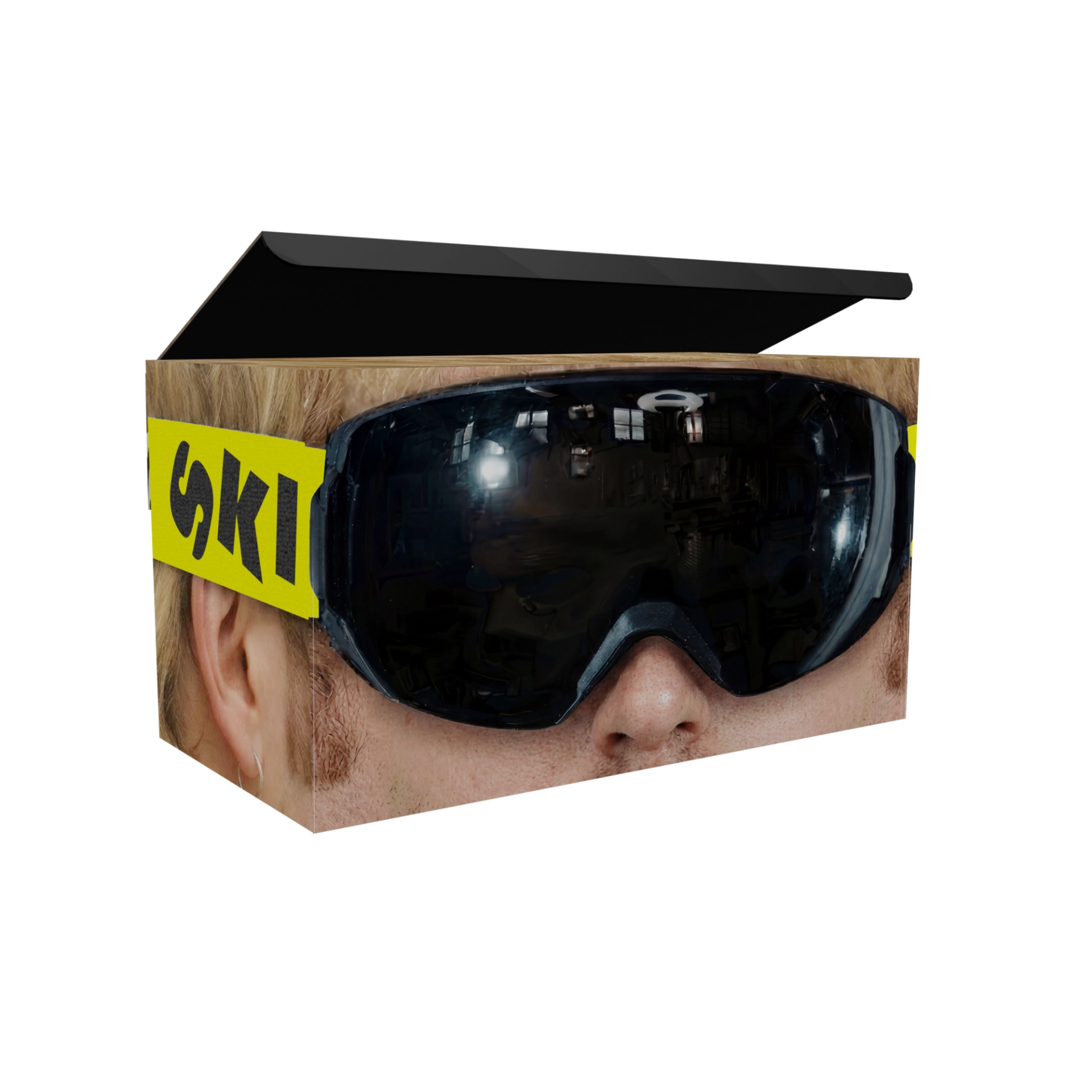 Ski Aggu product box printed with a close-up face wearing goggles with a yellow strap.
