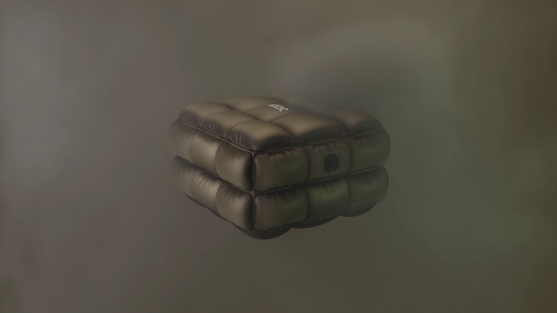 The whole quilted box floating against a grey-brown backdrop, two padded tiers with a lens on one side and a small logo on the lid.