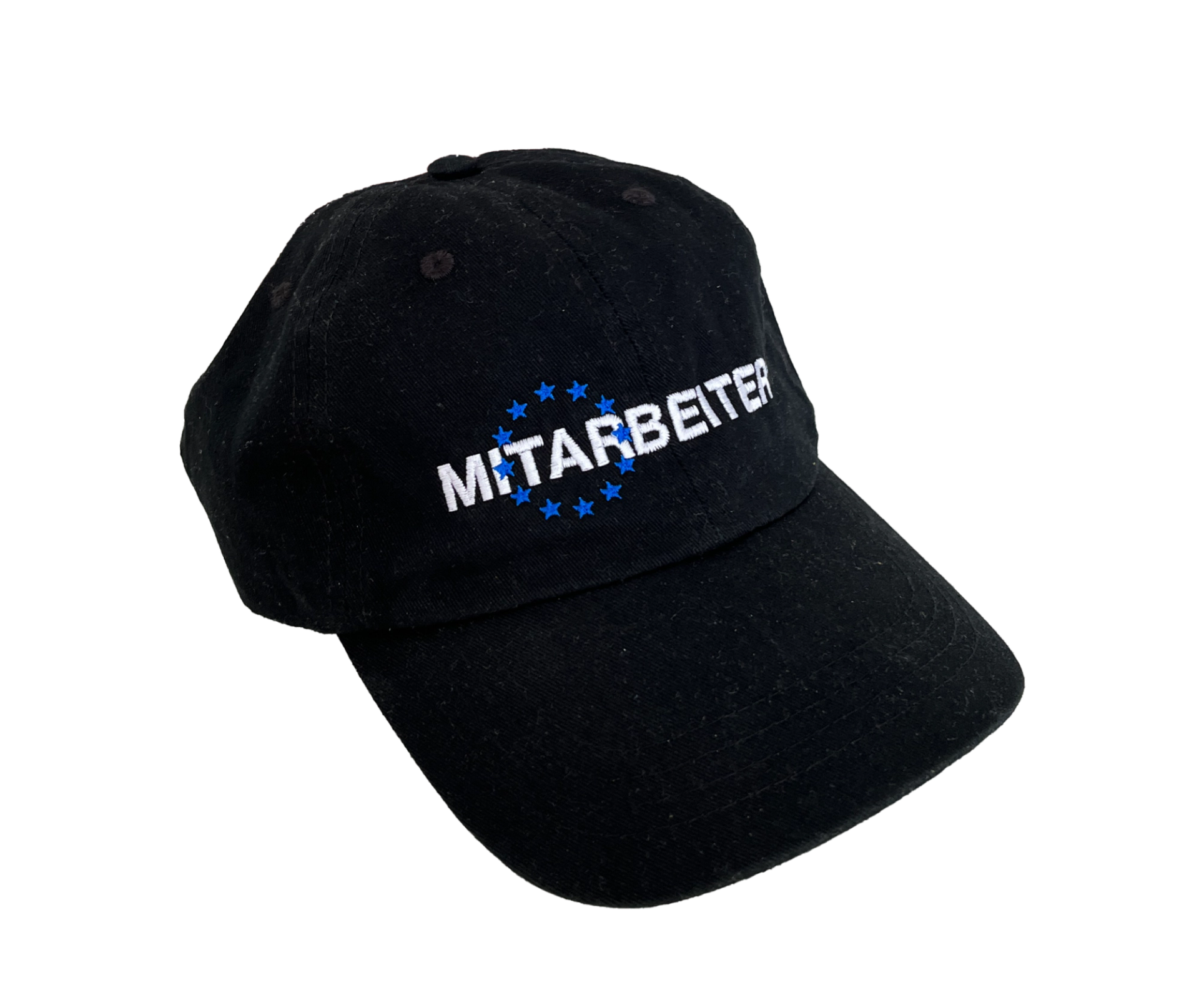 Black baseball cap with "MITARBEITER" embroidered in white across a ring of blue stars, its peak pointing right.