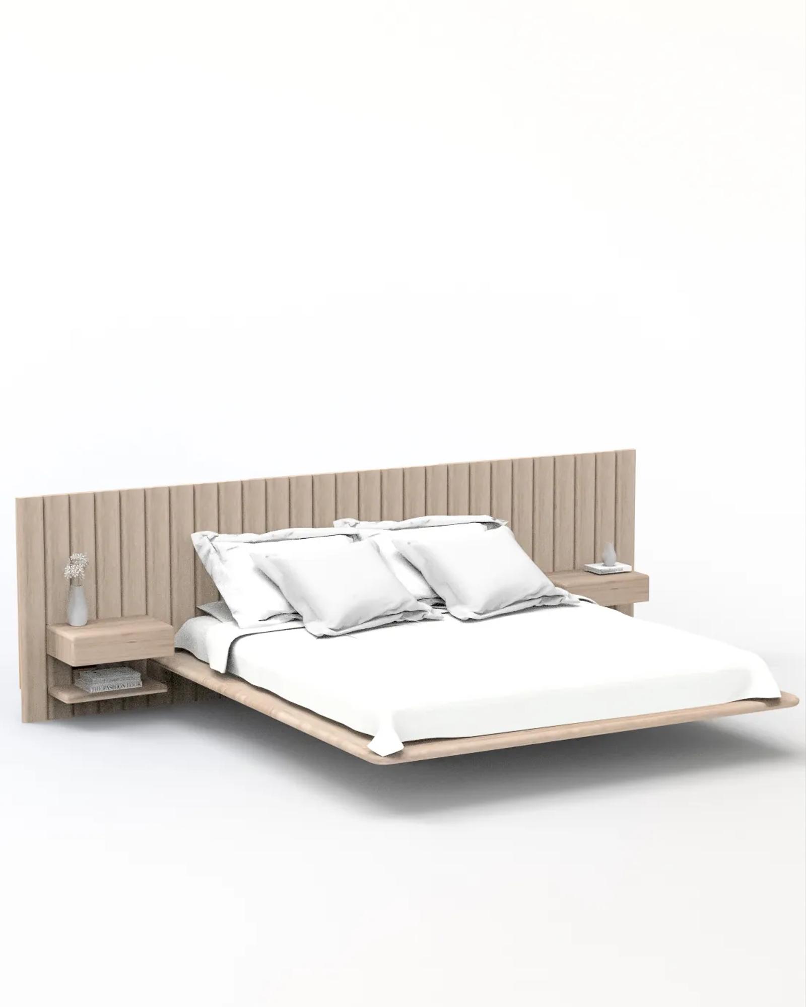 Ladovi Bed in natural oak, three-quarter view of the floating platform with a tall fluted headboard and integrated floating bedside tables