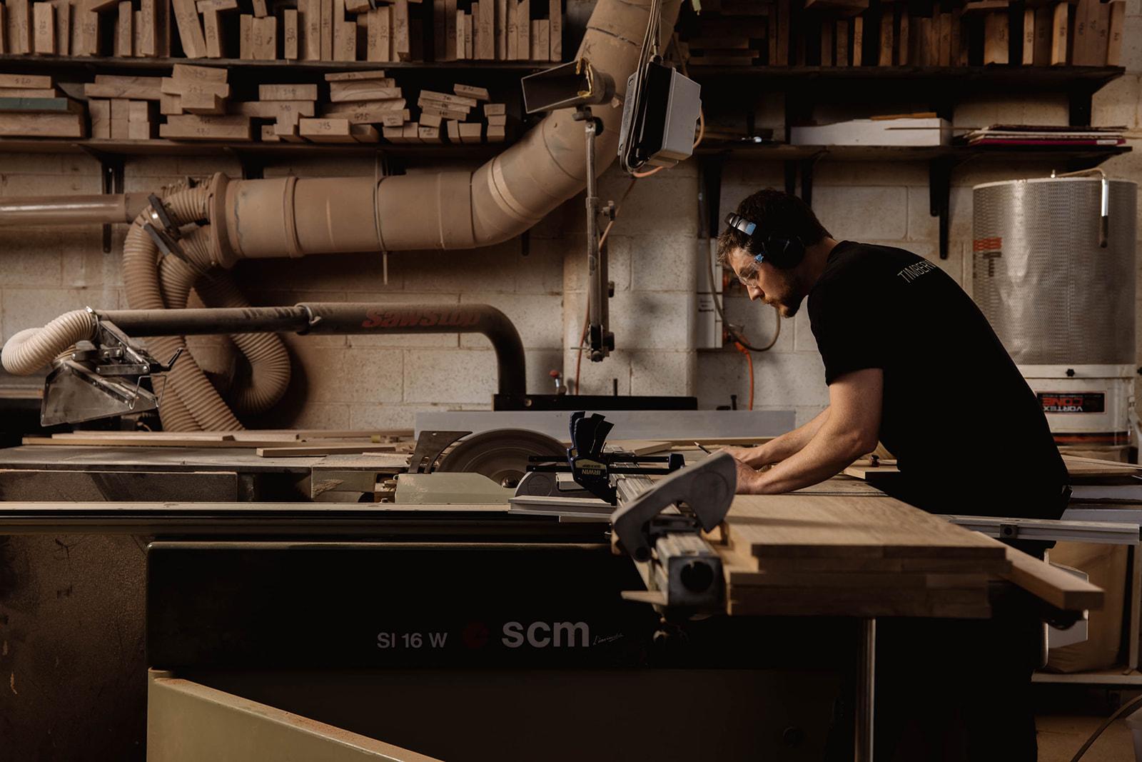 Jordan cutting solid panels precisely to length.