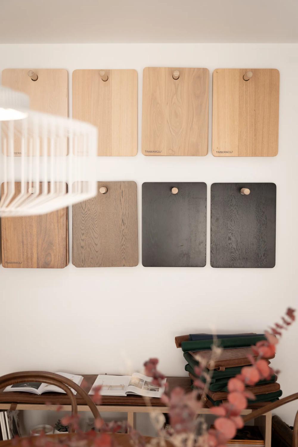 Timberwolf timber finish samples displayed on the showroom wall.