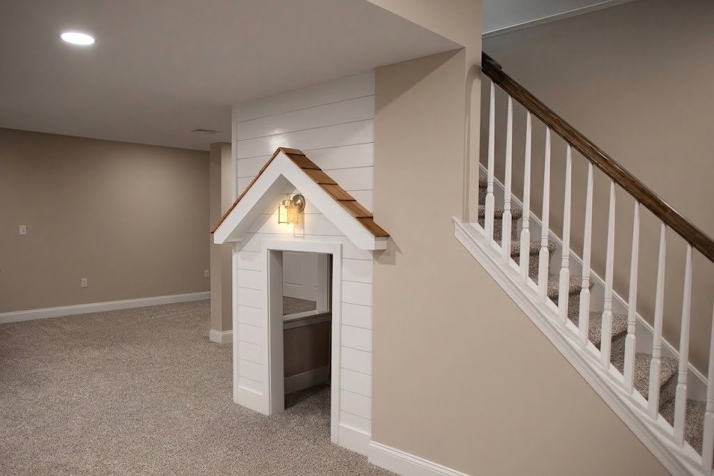 A photo of a modern finished basement with custom playhouse