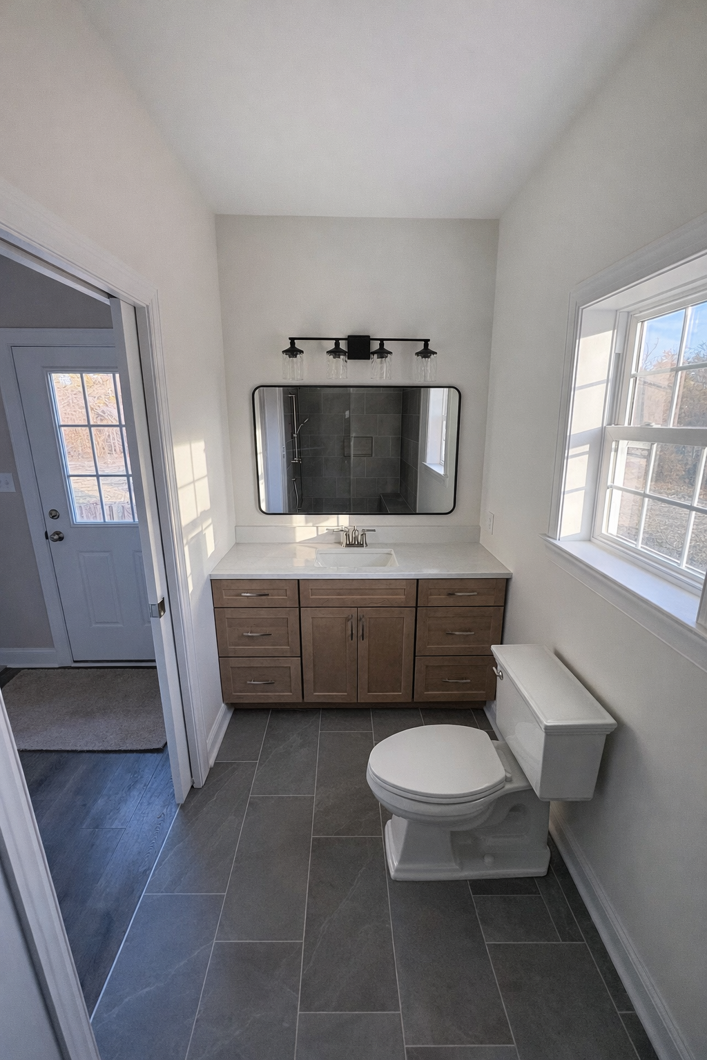 We designed and built a 12’ x 14’ in-law suite addition to the existing residence to provide a spacious new bedroom and a full bathroom