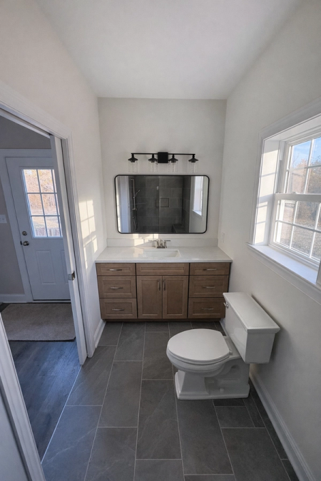 We designed and built a 12’ x 14’ in-law suite addition to the existing residence to provide a spacious new bedroom and a full bathroom