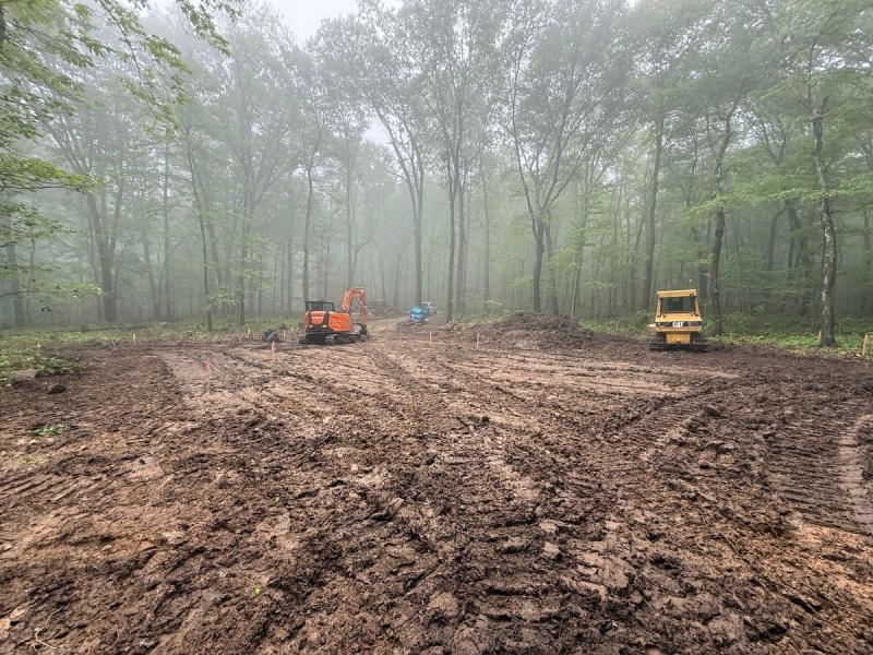 Excavator doing site work