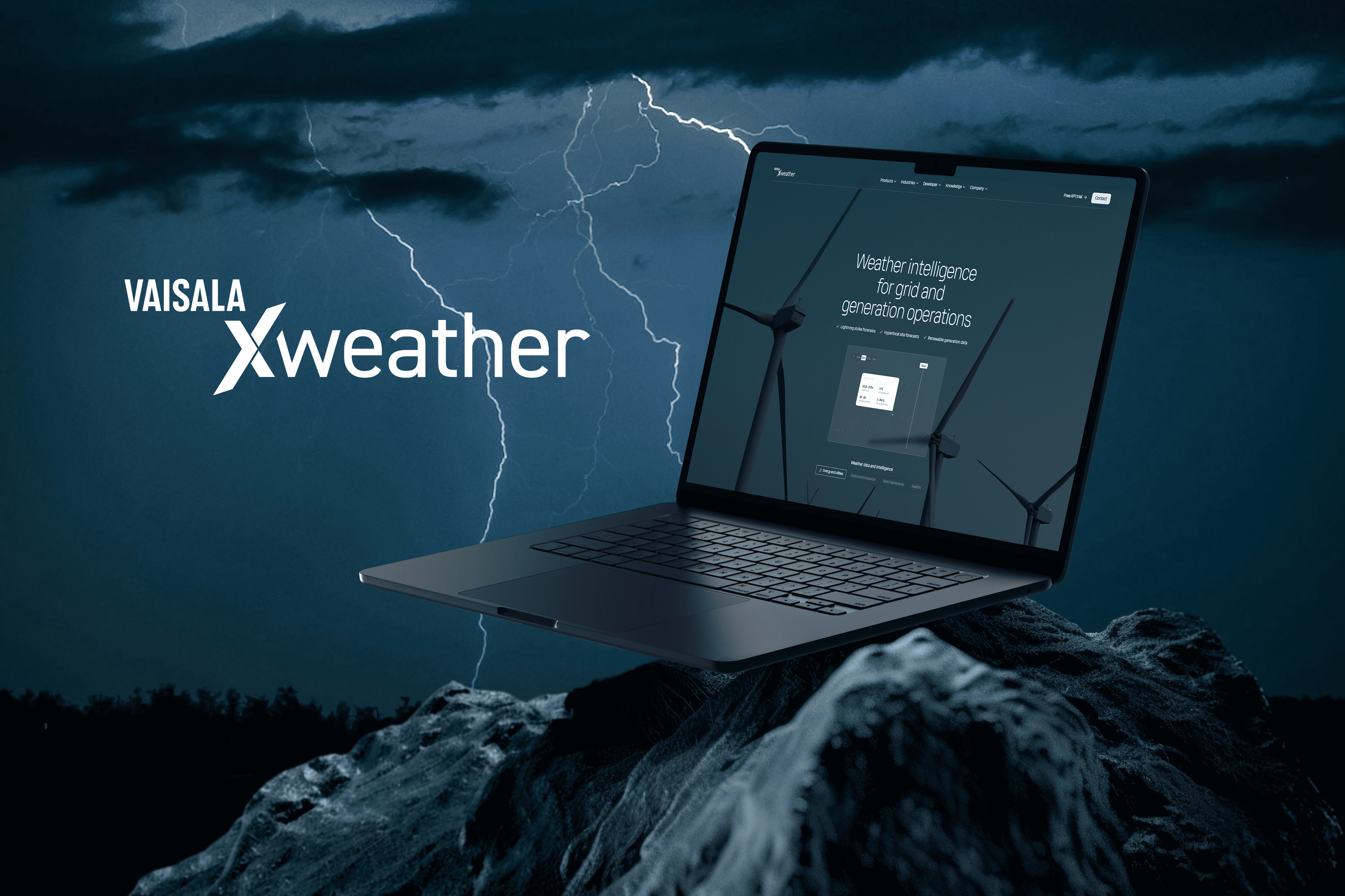 Laptop showing Vaisala Xweather wind energy dashboard against a stormy sky with lightning and wind turbines