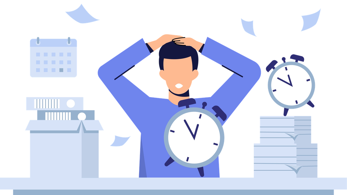 Illustration of a stressed man at a desk holding his head, surrounded by alarm clocks, stacks of paper and a calendar