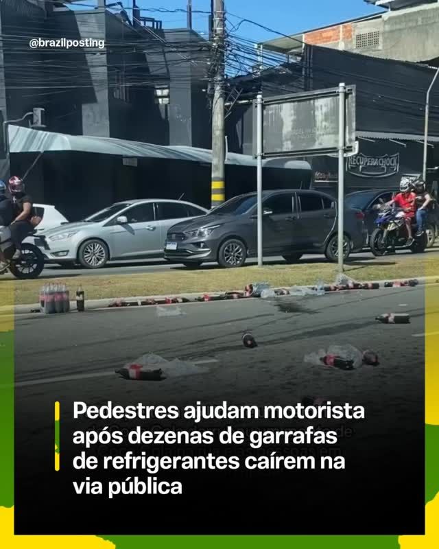 Carga de refrigerantes cai em avenida de Vitória e pedestres recolhem garrafas para devolver ao motorista