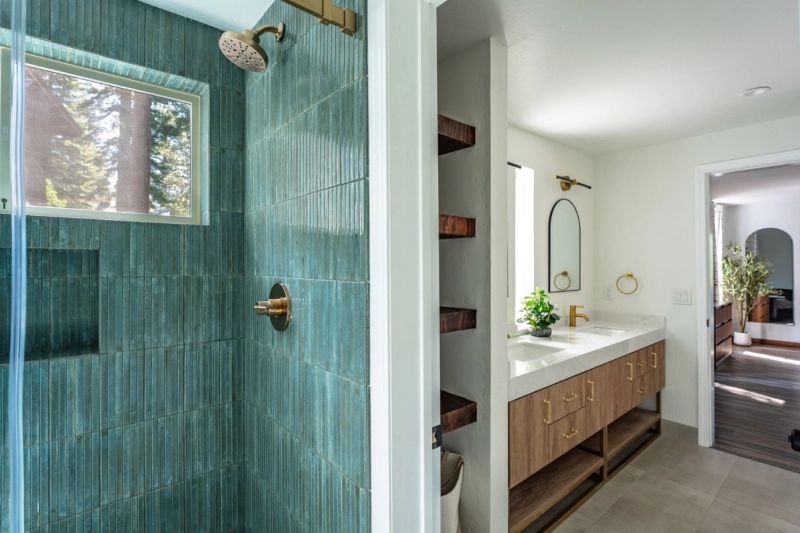 Primary ensuite with tiled walk-in shower and double vanity