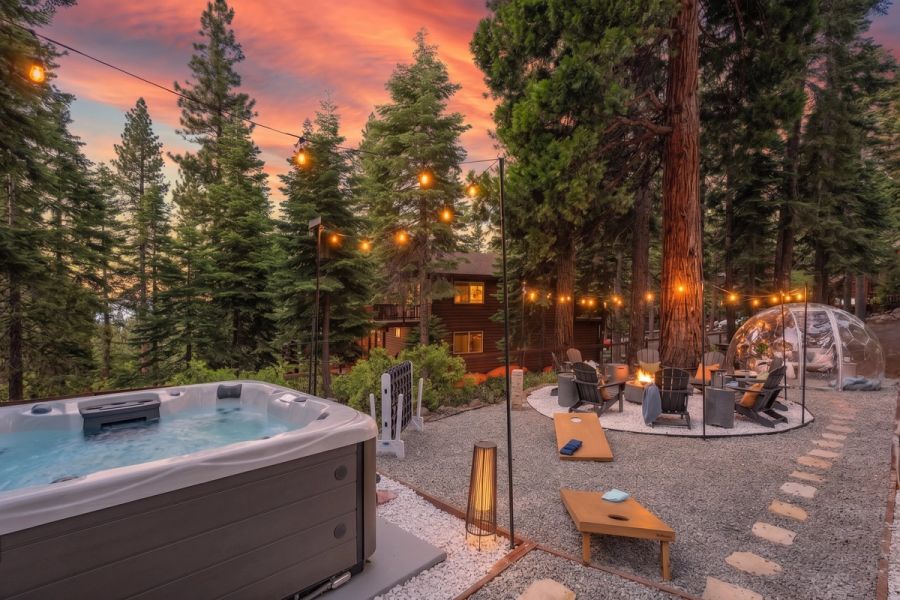 Sunset over the fire pit, hot tub, and stargazing dome